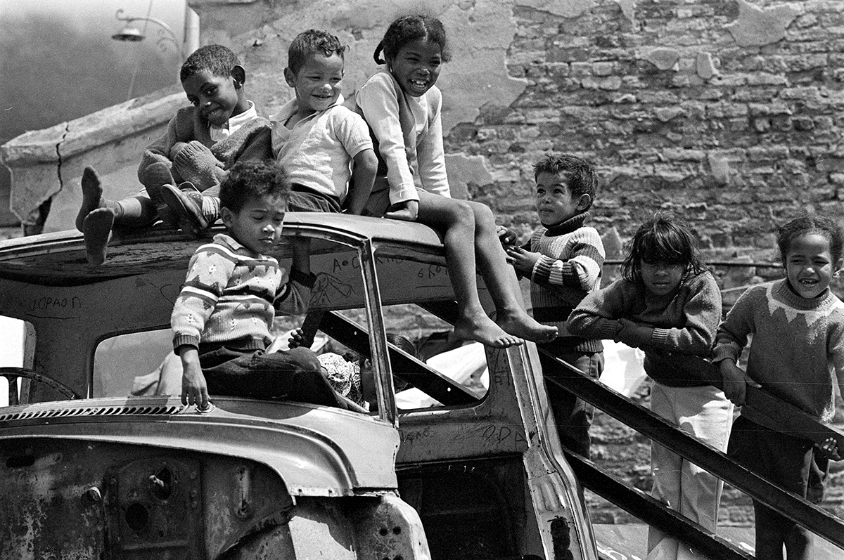 Kids playing on an abandoned car in District Six. Image taken by Juhan Kuus