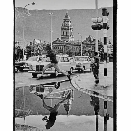 Obie Oberholzer | Man Jumping Puddle, Darling Street, Cape Town, 1968